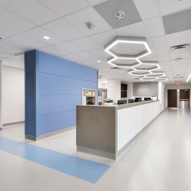 nora by Interface satura in hospital corridor